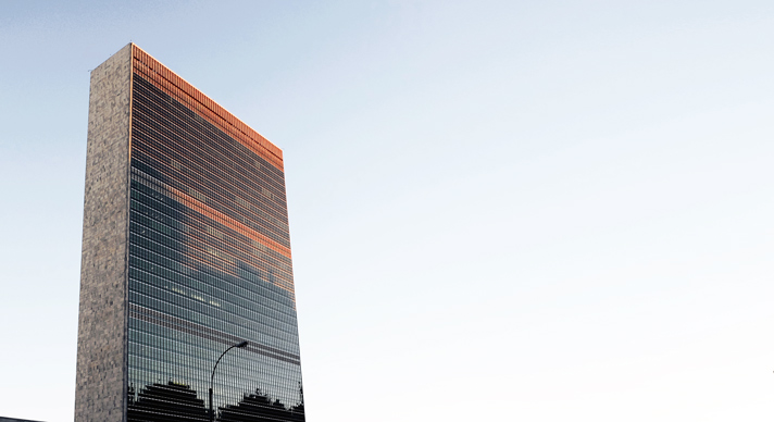Modern skyscraper building with reflective windows.